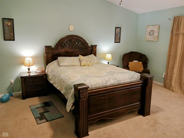 carpeted bedroom featuring vaulted ceiling