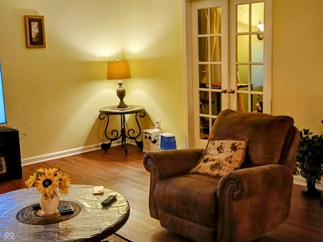 sitting room featuring hardwood / wood-style flooring and french doors