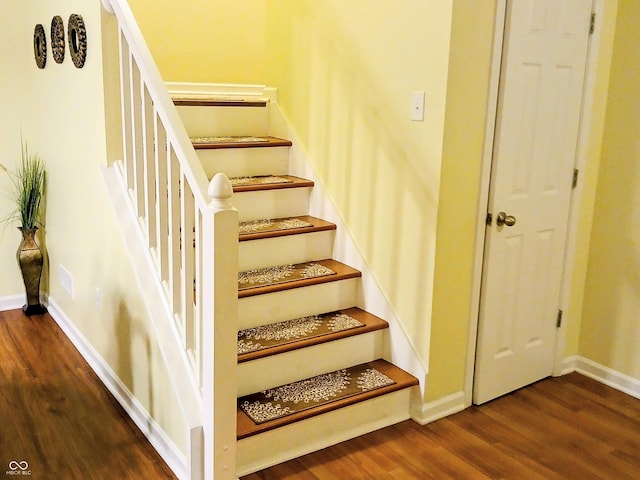 stairway featuring hardwood / wood-style flooring