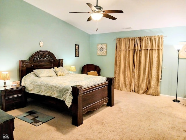 carpeted bedroom featuring vaulted ceiling and ceiling fan