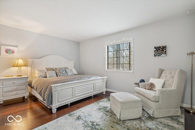 bedroom with dark wood-type flooring