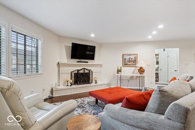 living room featuring hardwood / wood-style flooring and a fireplace