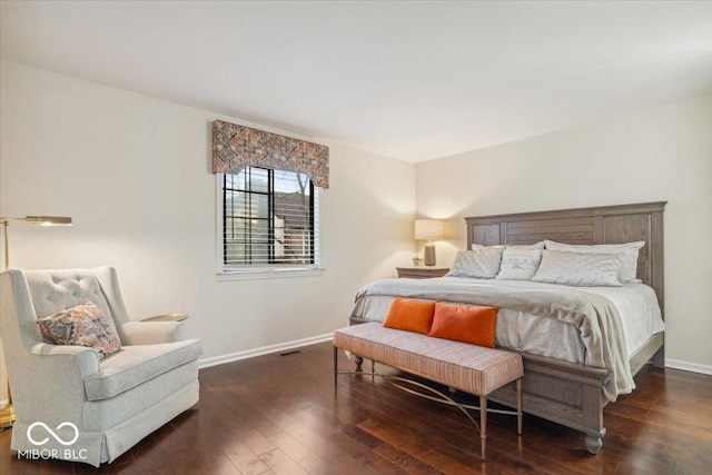 bedroom with dark wood-type flooring