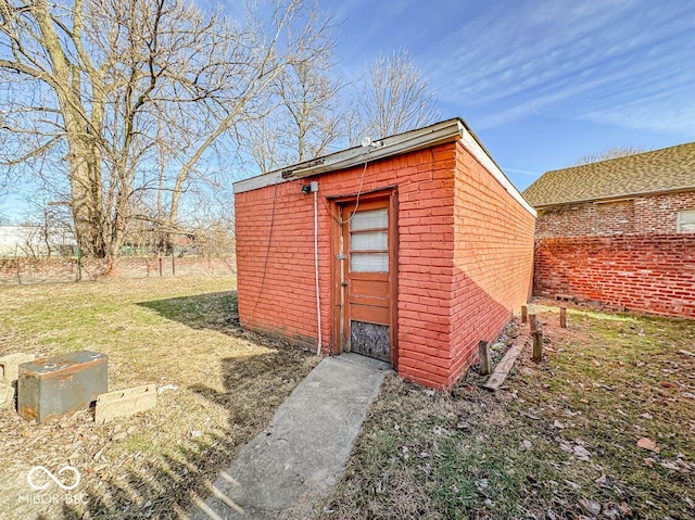 view of outbuilding featuring a lawn