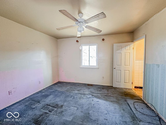 unfurnished room with ceiling fan and carpet flooring