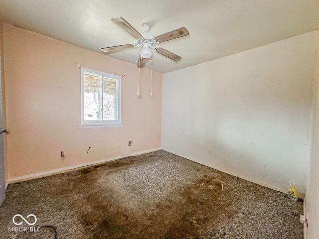 spare room with carpet flooring and ceiling fan