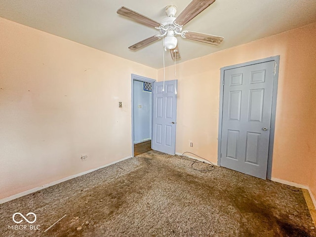 unfurnished bedroom featuring ceiling fan and carpet floors