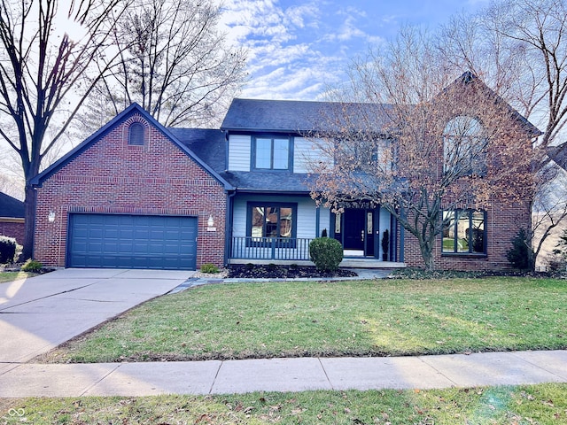 view of front property with a garage and a front lawn