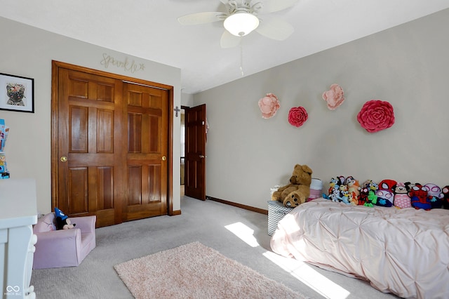 carpeted bedroom featuring ceiling fan