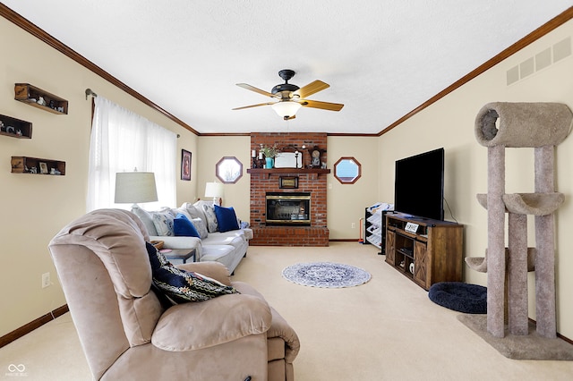 carpeted living room featuring crown molding, ceiling fan, a textured ceiling, and a fireplace