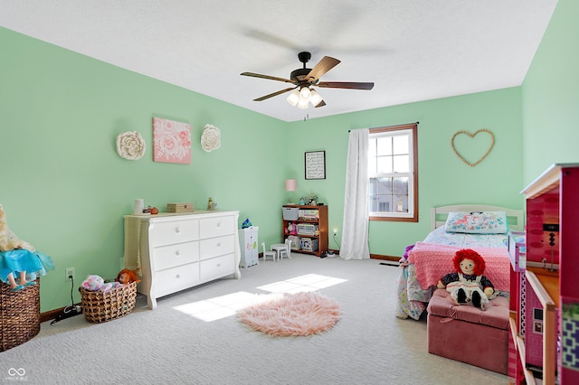 bedroom with light carpet, a textured ceiling, and ceiling fan