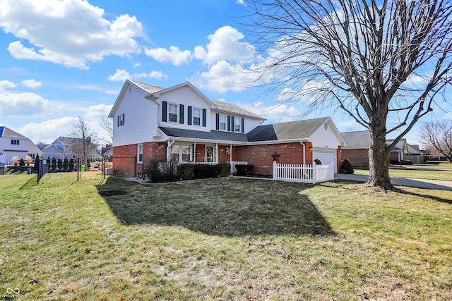 view of property with a garage and a front yard