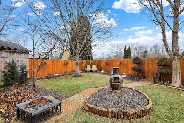 view of yard with a fire pit