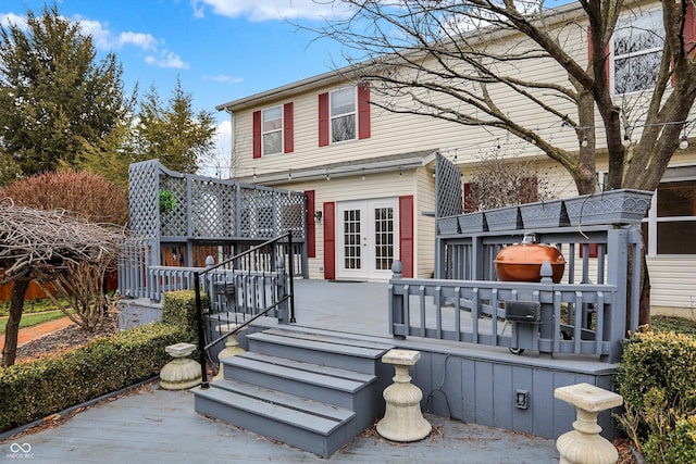 view of front of house with a wooden deck and french doors