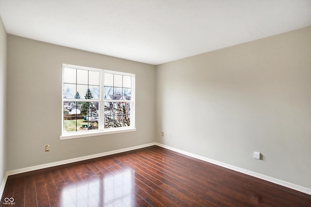 spare room featuring dark hardwood / wood-style floors