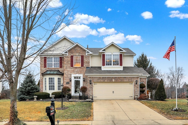 view of front of home with a garage and a front yard