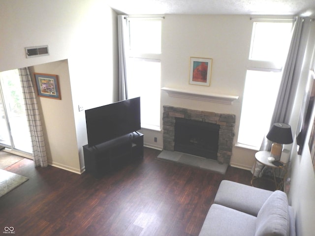 7459 Quincy Ct, Indianapolis, IN 46254 - living room with a stone fireplace, wood finished floors, and baseboards