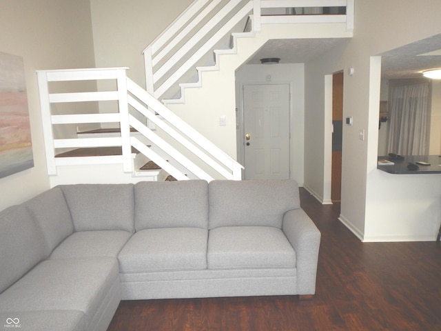 7459 Quincy Ct, Indianapolis, IN 46254 - living room featuring wood finished floors, stairway, and baseboards