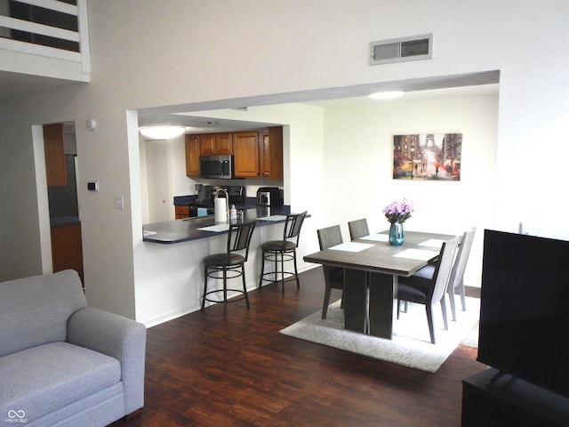7459 Quincy Ct, Indianapolis, IN 46254 - dining room with dark wood-type flooring and a high ceiling