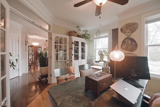 interior space with crown molding, dark hardwood / wood-style floors, ceiling fan, and french doors