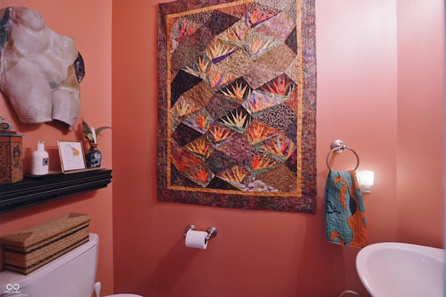 bathroom featuring sink and toilet