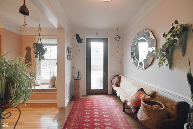 foyer featuring hardwood / wood-style flooring and ornamental molding