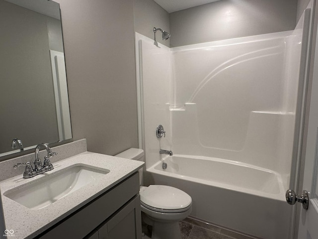 full bathroom featuring vanity, tub / shower combination, and toilet