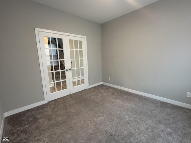 carpeted spare room with french doors