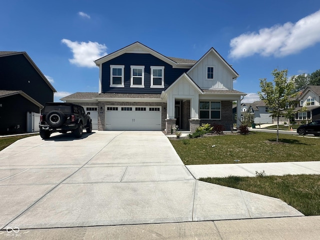 view of front of home with a garage and a front yard