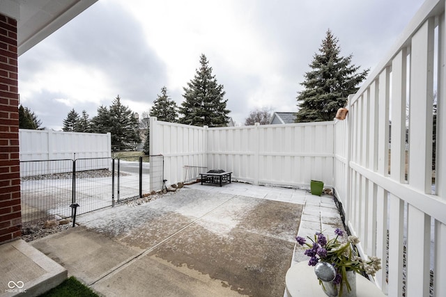 view of patio / terrace with an outdoor fire pit