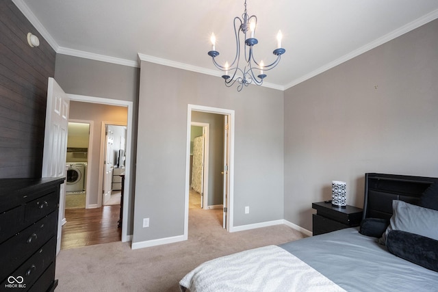 bedroom with crown molding, washer / dryer, light carpet, and a chandelier