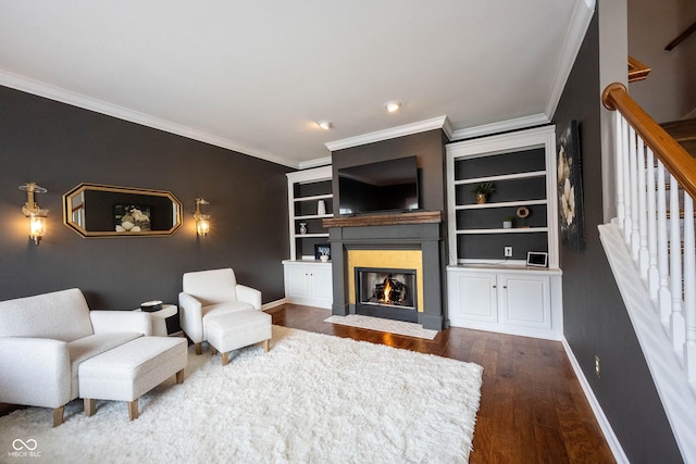 living room with dark wood-type flooring and ornamental molding