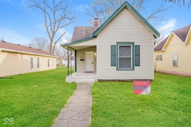 bungalow-style house featuring a front yard