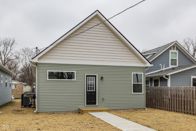 back of property featuring central AC unit