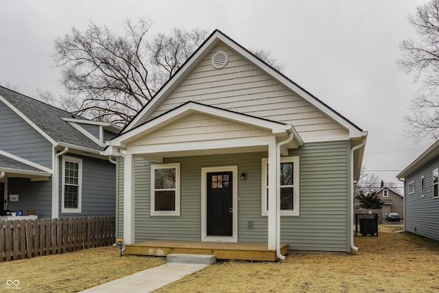 bungalow-style home with central AC unit