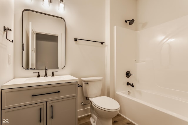 full bathroom featuring vanity, toilet, hardwood / wood-style floors, and shower / bathing tub combination