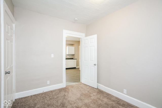 unfurnished bedroom featuring carpet