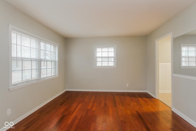 empty room featuring dark wood-type flooring