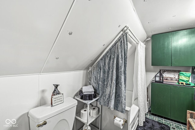 bathroom featuring shower / bathtub combination and toilet