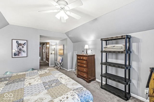 carpeted bedroom featuring lofted ceiling and ceiling fan