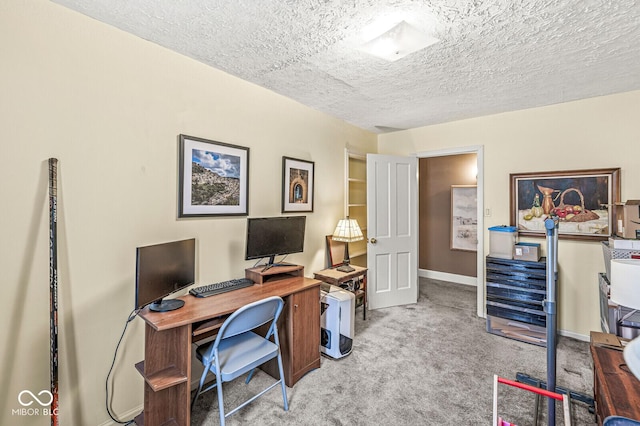 office area with light carpet and a textured ceiling