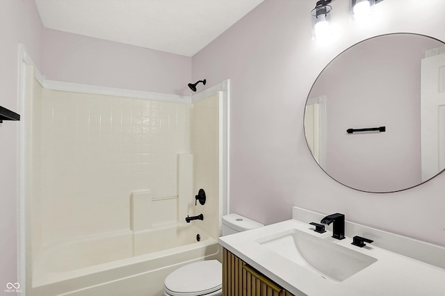 full bathroom featuring vanity, washtub / shower combination, and toilet