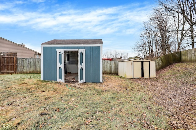 view of outbuilding featuring a lawn