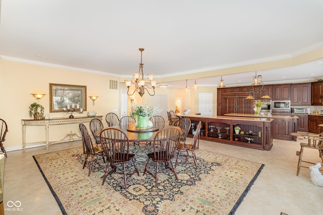 tiled dining area with ornamental molding and a chandelier