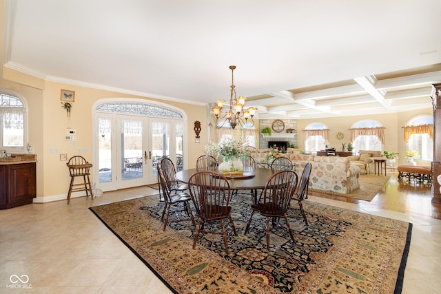 dining space featuring french doors, coffered ceiling, beam ceiling, and crown molding