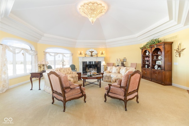 living room with ornamental molding, a premium fireplace, and light carpet