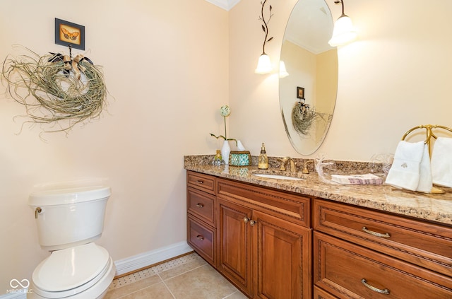 bathroom with vanity, tile patterned floors, and toilet