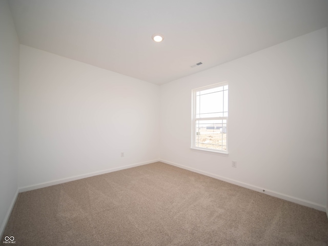 unfurnished room featuring baseboards, carpet flooring, and recessed lighting