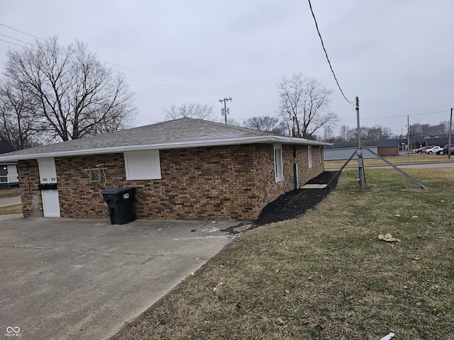 view of home's exterior with a lawn