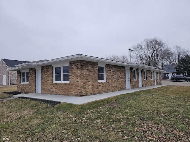 view of home's exterior with a yard